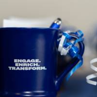 Coffee mug with text "Engage, Enrich, Transform"